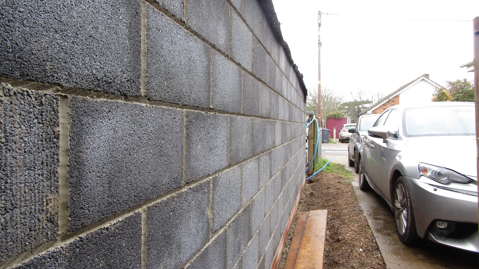 A wall of concrete blocks under construction