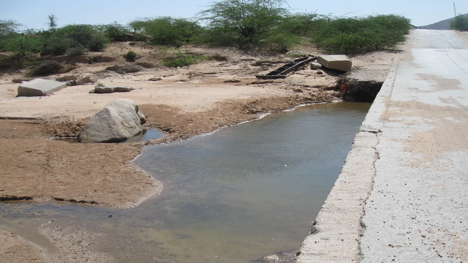 Water held behind a small concrete weir in a dry riverbed in Somaliland