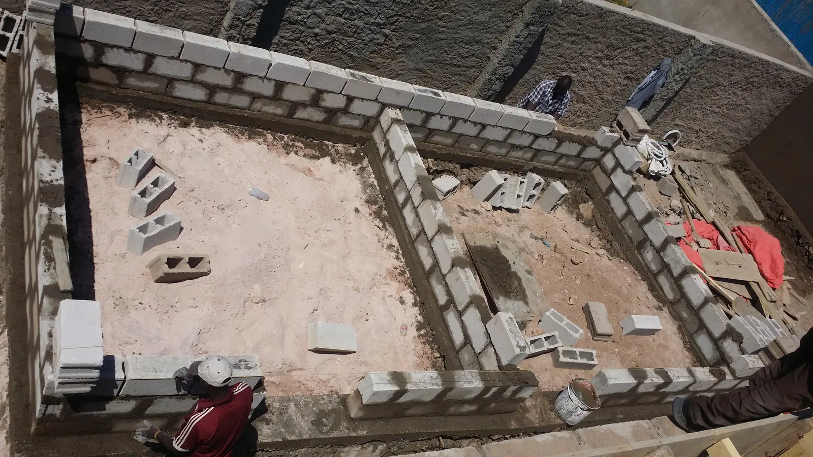 Concrete block walls rising on a slab at a building site in Hargeisa