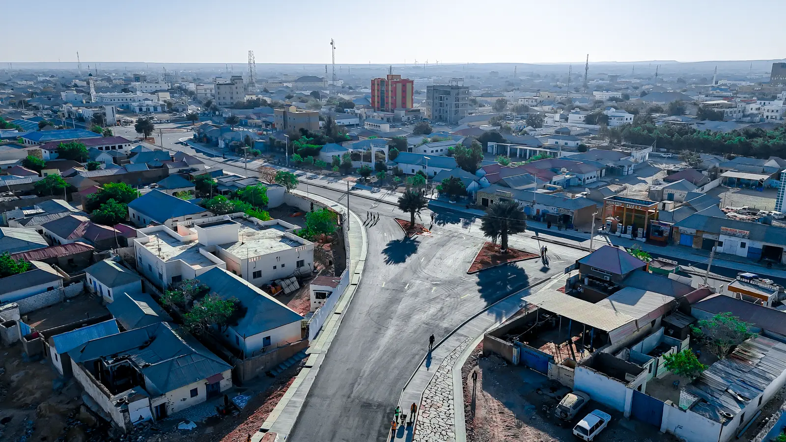 A junction of surfaced streets and side drains in Garowe from the air
